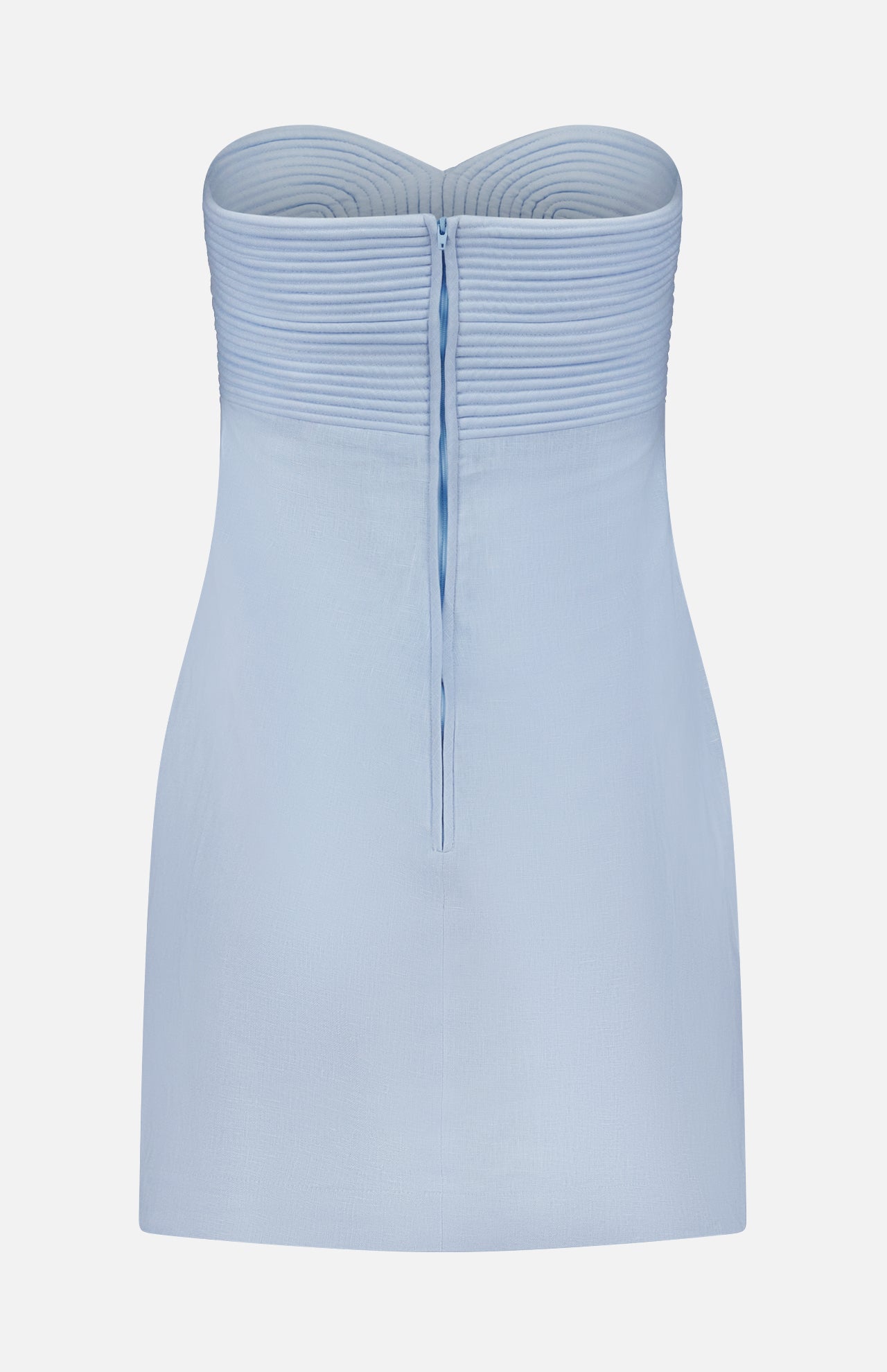 The Amari Ama Linen Mini Dress by ANDRÉS OTÁLORA is a strapless baby blue mini with a structured, pleated bodice and vertical back zipper, displayed on a white background. Mediterranean-inspired for effortless charm at any event.