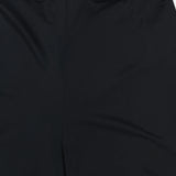 Close-up of ANDRÉS OTÁLORA En Calma Palm Print Pants, highlighting the elastic waistband and upper pant legs in midnight navy. The fabric looks smooth with a slight sheen.