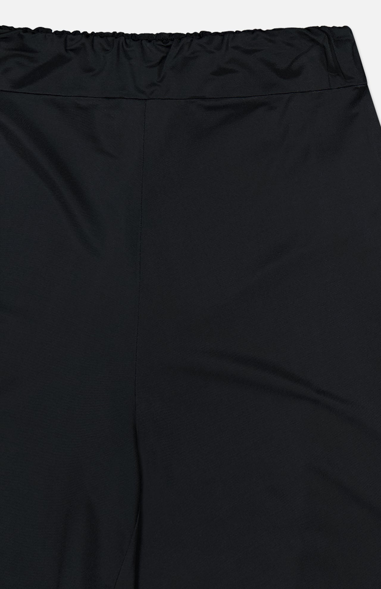 Close-up of ANDRÉS OTÁLORA En Calma Palm Print Pants, highlighting the elastic waistband and upper pant legs in midnight navy. The fabric looks smooth with a slight sheen.