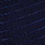 Close-up of the ANDRÉS OTÁLORA Eterna Brisa Embroidered Midi Dress fabric, featuring horizontal textured stripes that create a subtle pattern—an elegant detail for this linen midi dress with adjustable straps.