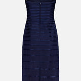 The Eterna Brisa Embroidered Midi Dress by ANDRÉS OTÁLORA is a sleeveless navy and black dress with adjustable thin straps and horizontal bands, shown against a plain white background.