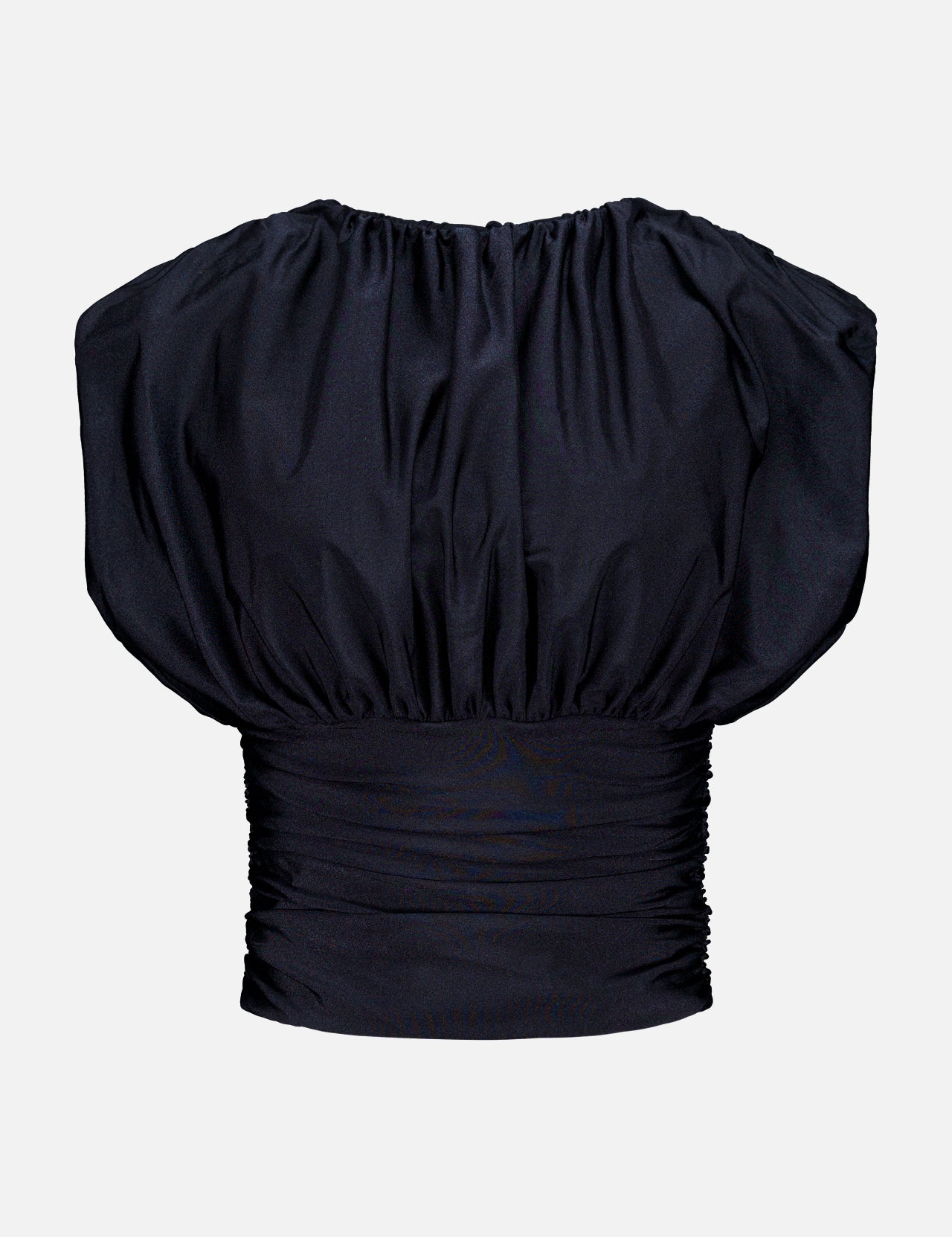 The Tan Lejos Top by ANDRÉS OTÁLORA is a sculptural black short-sleeved blouse with ruching, a wide gathered neckline, and fitted pleated waistband—an elegant going-out top shown on a plain white background.