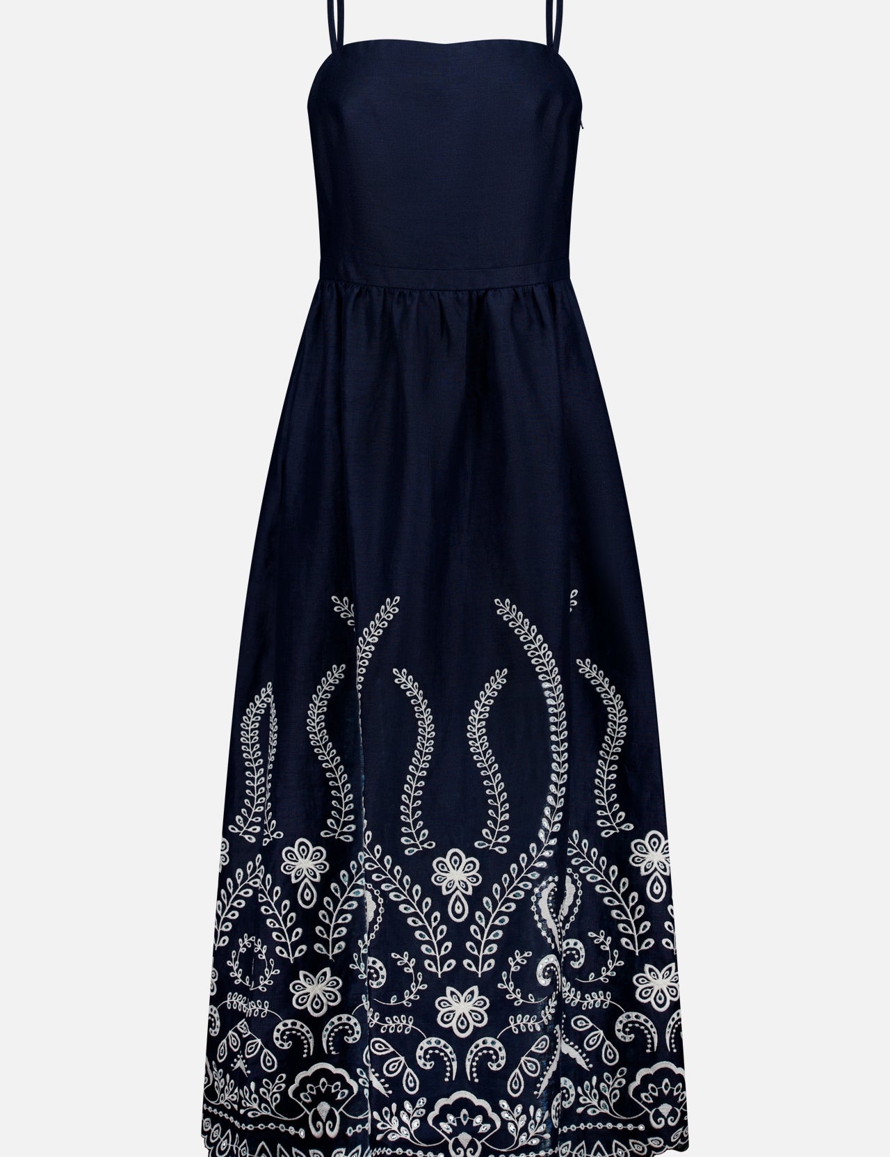 The ANDRÉS OTÁLORA Y Tu Voz Eyelet Dress is a navy blue linen piece with thin straps, a fitted bodice, white floral embroidery on the lower half, and a scalloped hem.