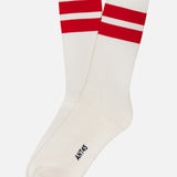 The Bernera Short Socks by ANT45 are white cotton socks with two bold red stripes near the top and "ANT45" printed in black near the toe, displayed on a plain white background.