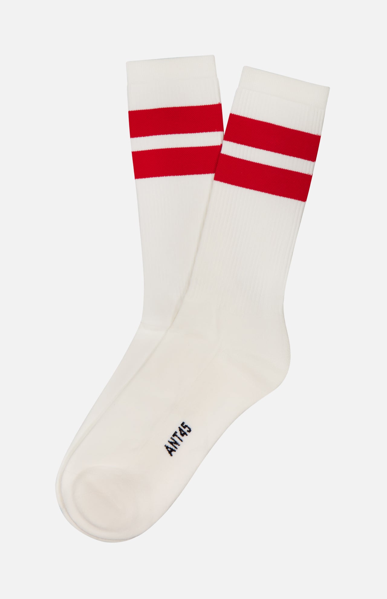 The Bernera Short Socks by ANT45 are white cotton socks with two bold red stripes near the top and "ANT45" printed in black near the toe, displayed on a plain white background.