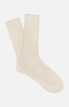 The ANT45 Blog Short Socks, in cream with a classic ribbed design, are laid out flat on a white background.