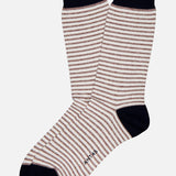 A pair of ANT45 Midett Short Socks with thin beige and white stripes and solid black toes, heels, and cuffs. "ARTIS" is printed near the toe on one sock—crafted for fans of classic Italian style.
