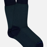 The Oxford Short Socks by ANT45 are dark navy blue Mercerized cotton dress socks with black cuffs, heels, and toes, made in Italy, shown on a plain white background.