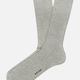 A pair of Sable Short Socks from ANT45 in light gray cotton linen, laid flat on a white background with "ANT45" printed near the toe, crafted in the tradition of Italian hosiery.