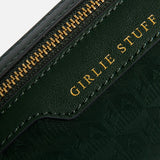 Dark green jacquard nylon Logo Girlie Stuff Pouch featuring the words GIRLIE STUFF embossed in gold lettering.