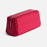 Anya Hindmarch Logo Girlie Stuff Pouch: a rectangular magenta zippered travel pouch with a repeating geometric jacquard nylon pattern.
