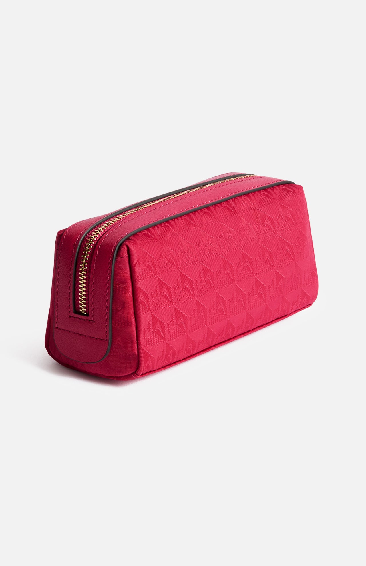 Anya Hindmarch Logo Girlie Stuff Pouch: a rectangular magenta zippered travel pouch with a repeating geometric jacquard nylon pattern.