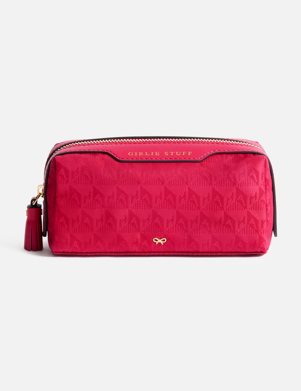 Anya Hindmarch Logo Girlie Stuff Pouch in rectangular magenta jacquard nylon, featuring a tassel zipper pull, embossed text, and a small gold bow emblem.