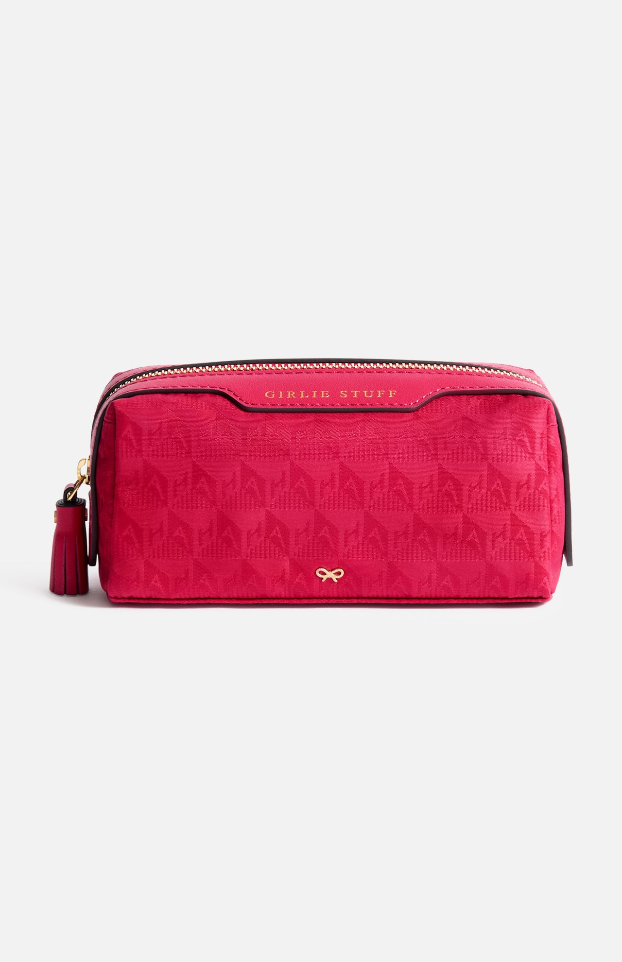 Anya Hindmarch Logo Girlie Stuff Pouch in rectangular magenta jacquard nylon, featuring a tassel zipper pull, embossed text, and a small gold bow emblem.