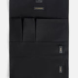 Black Anya Hindmarch Logo Hair Kit Travel Pouch with multiple interior pockets labeled Attachments, Wand, and Cables.