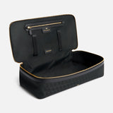 Open black Anya Hindmarch Logo Hair Kit Travel Pouch with gold zippers and an interior label reading BRUSHES.