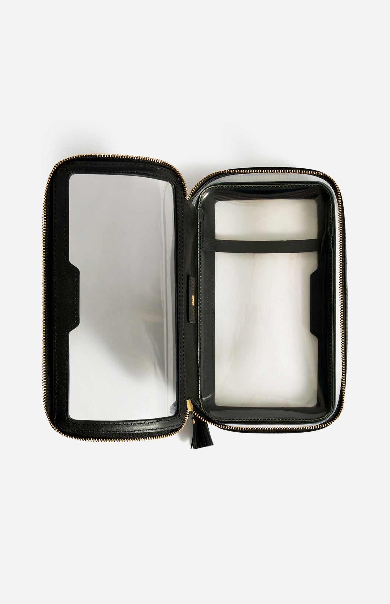 Anya Hindmarch Logo In-Flight Case, an open rectangular travel accessory with a gold-tone zipper, clear sides, internal dividers, and a secure zip closure.