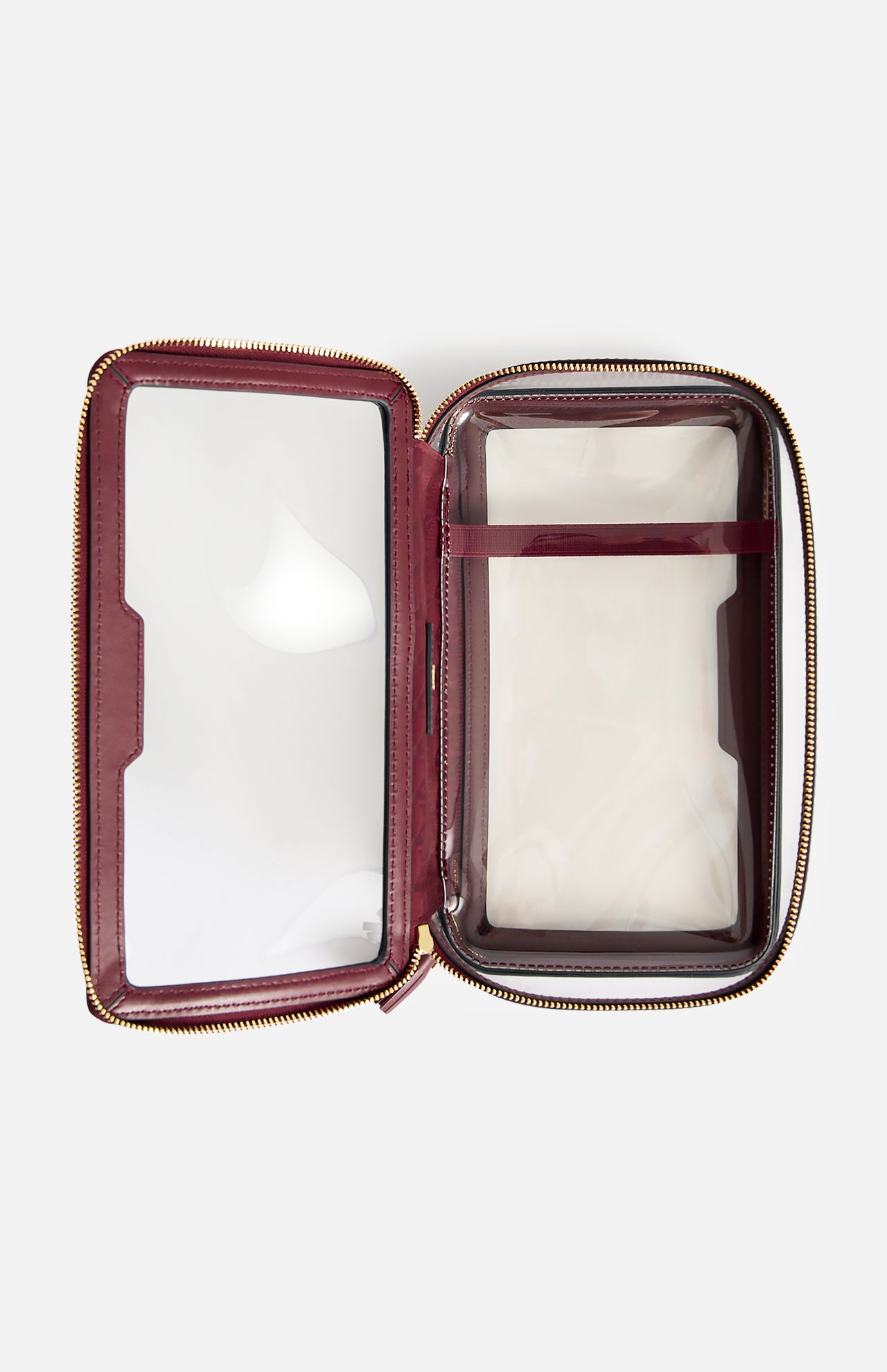Open, rectangular burgundy Anya Hindmarch Logo In-Flight Case with transparent plastic panels and a gold-tone zipper.