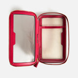 Anya Hindmarch Logo In-Flight Case, an open rectangular case with pink trim, clear windows, and a gold-tone zipper.