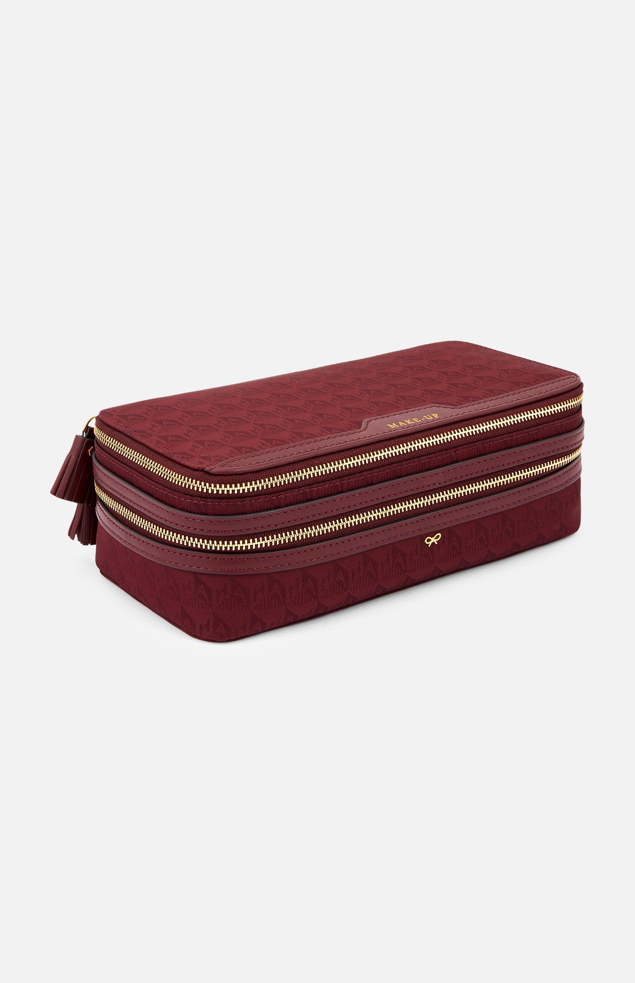 Burgundy rectangular Anya Hindmarch Logo Make-Up Pouch with two organizational zippered compartments, gold-toned hardware, and a small logo emblem.