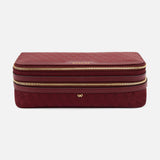 Burgundy rectangular Anya Hindmarch Logo Make-Up Pouch with two gold zippers, organizational compartments, and a gold bow emblem on the front.