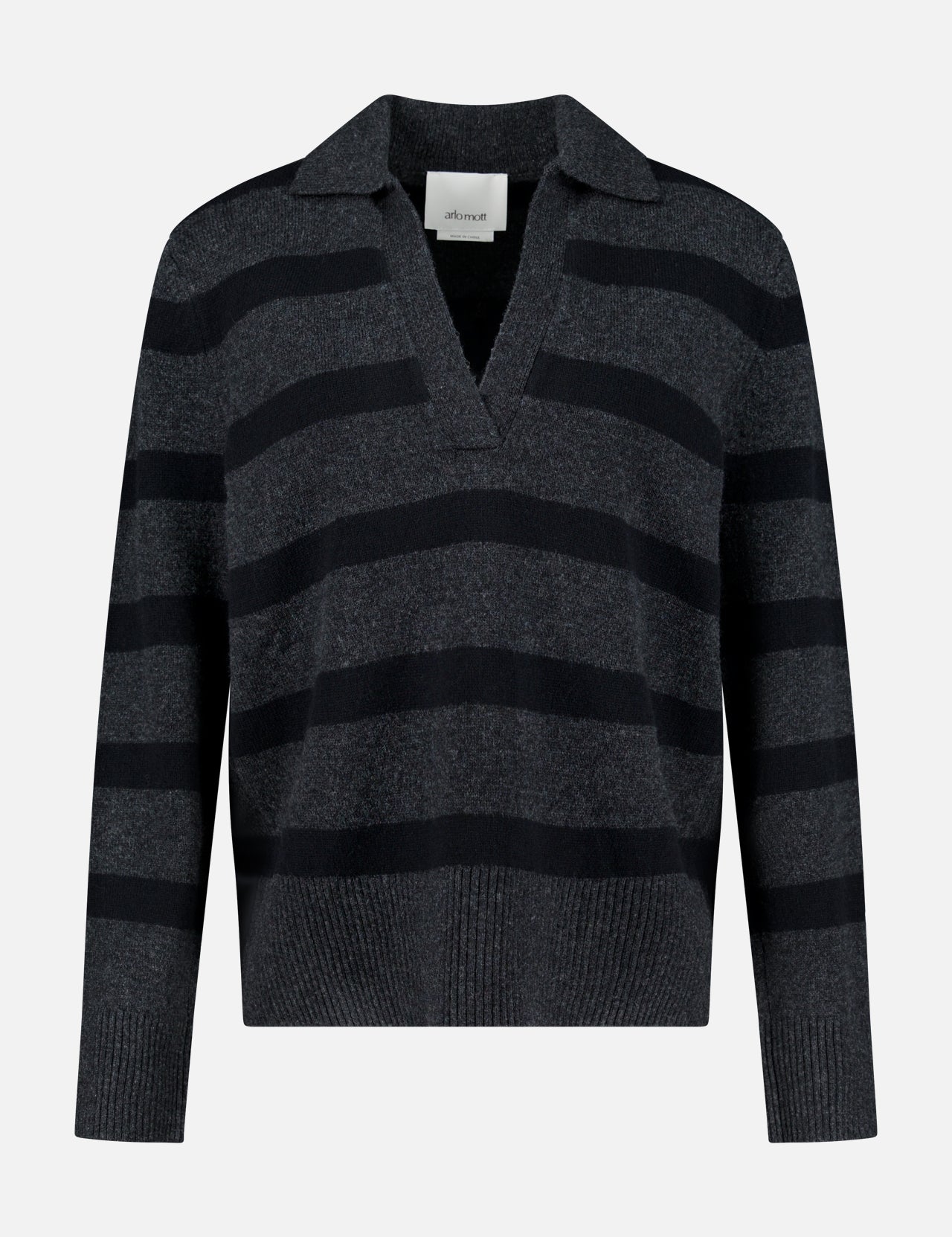 The Allen Wool Cashmere Oversized Sweater by ARLO MOTT features wide black horizontal stripes on a dark gray background, complemented by a V-neckline and collar. This charcoal stripe sweater is shown against a plain white backdrop.