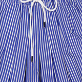 The Gates Full Midi Skirt by ARLO MOTT features blue and white vertical stripes in Portuguese poplin, finished with an elastic drawstring waist tied in a neat bow at the front.