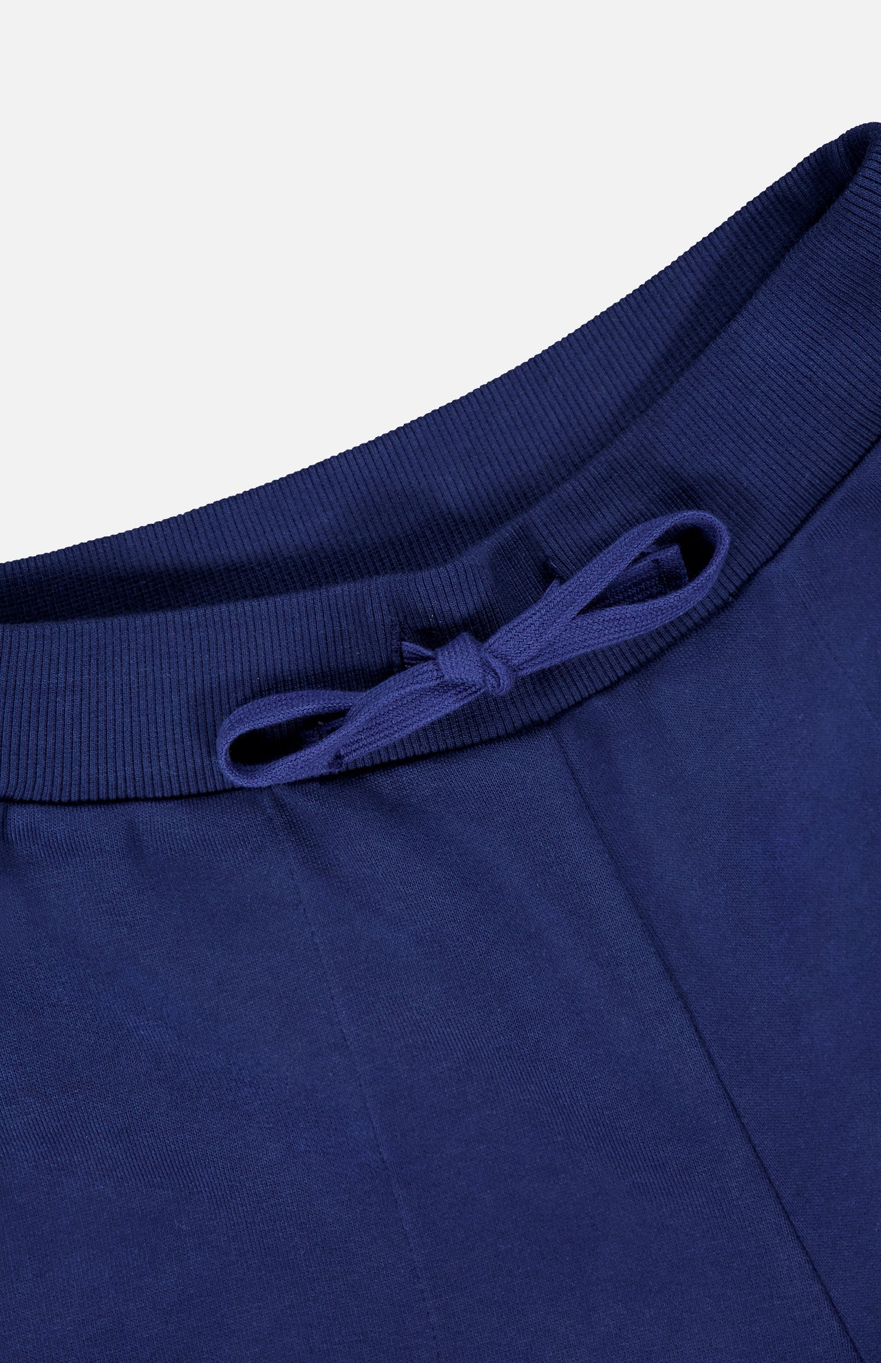 Close-up of the ribbed, navy blue waistband with adjustable drawstring on ARLO MOTT’s Kane Cropped Wide Sweatpants—stylish comfort for elevating your casual look.