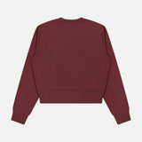 A back view of the ARLO MOTT Kent Crewneck with Side Snaps in berry, featuring long sleeves, a crew neck, ribbed cuffs, and a ribbed waistband, laid flat on a white background.