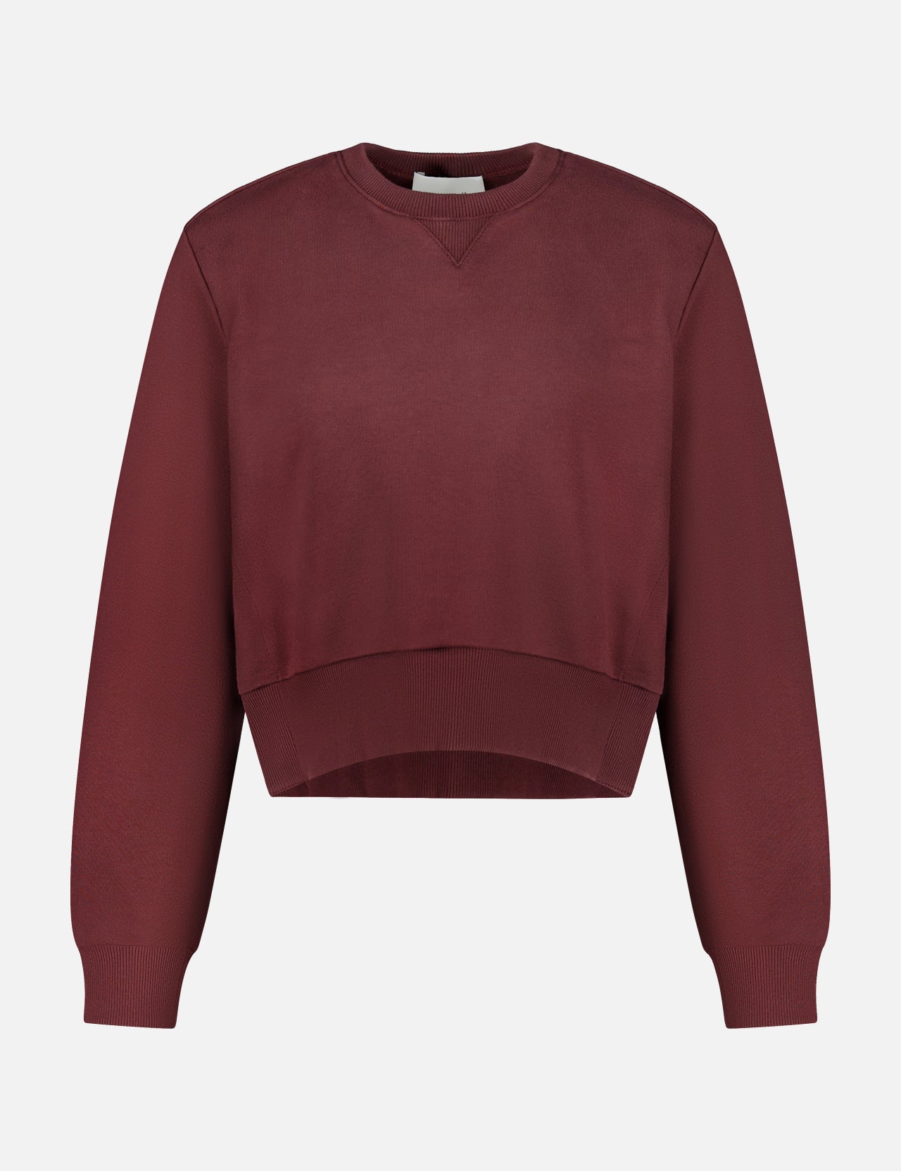 The ARLO MOTT Kent Crewneck with Side Snaps is a berry-colored, maroon cropped sweatshirt featuring long sleeves and ribbed cuffs, hem, and neckline, shown against a plain white background.