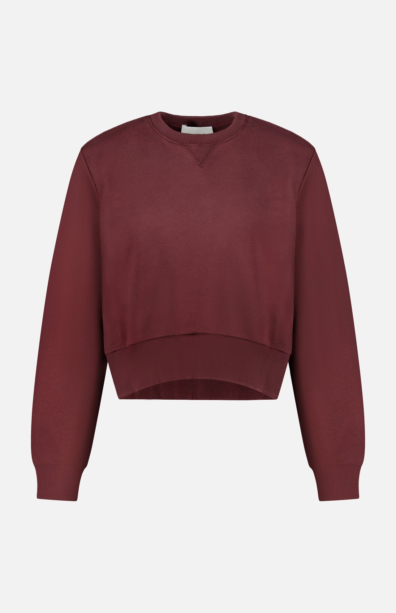 The ARLO MOTT Kent Crewneck with Side Snaps is a berry-colored, maroon cropped sweatshirt featuring long sleeves and ribbed cuffs, hem, and neckline, shown against a plain white background.