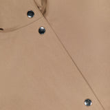 Close-up of the ARLO MOTT Logan Tech Water Resistant Jacket in tan Italian gabardine, showcasing a diagonal seam, four metallic snap buttons, and a top left pocket detail. The fabric offers water resistance for extra practicality.