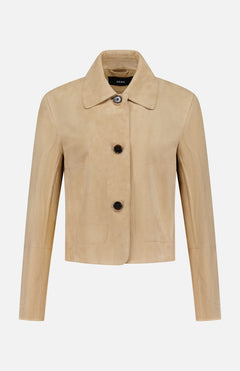 The Emy Goat Suede Jacket by ARMA is a light tan beige cropped jacket with a pointed collar, long sleeves, three dark buttons, and a minimalist, tailored design in goat leather shown on a white background.