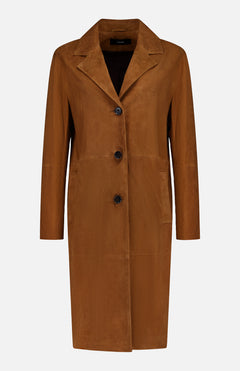 The ARMA Jella Goat Suede Jacket features a whiskey hue, notched collar, three black front buttons, long sleeves, and two large front pockets. Shown against a plain white background.