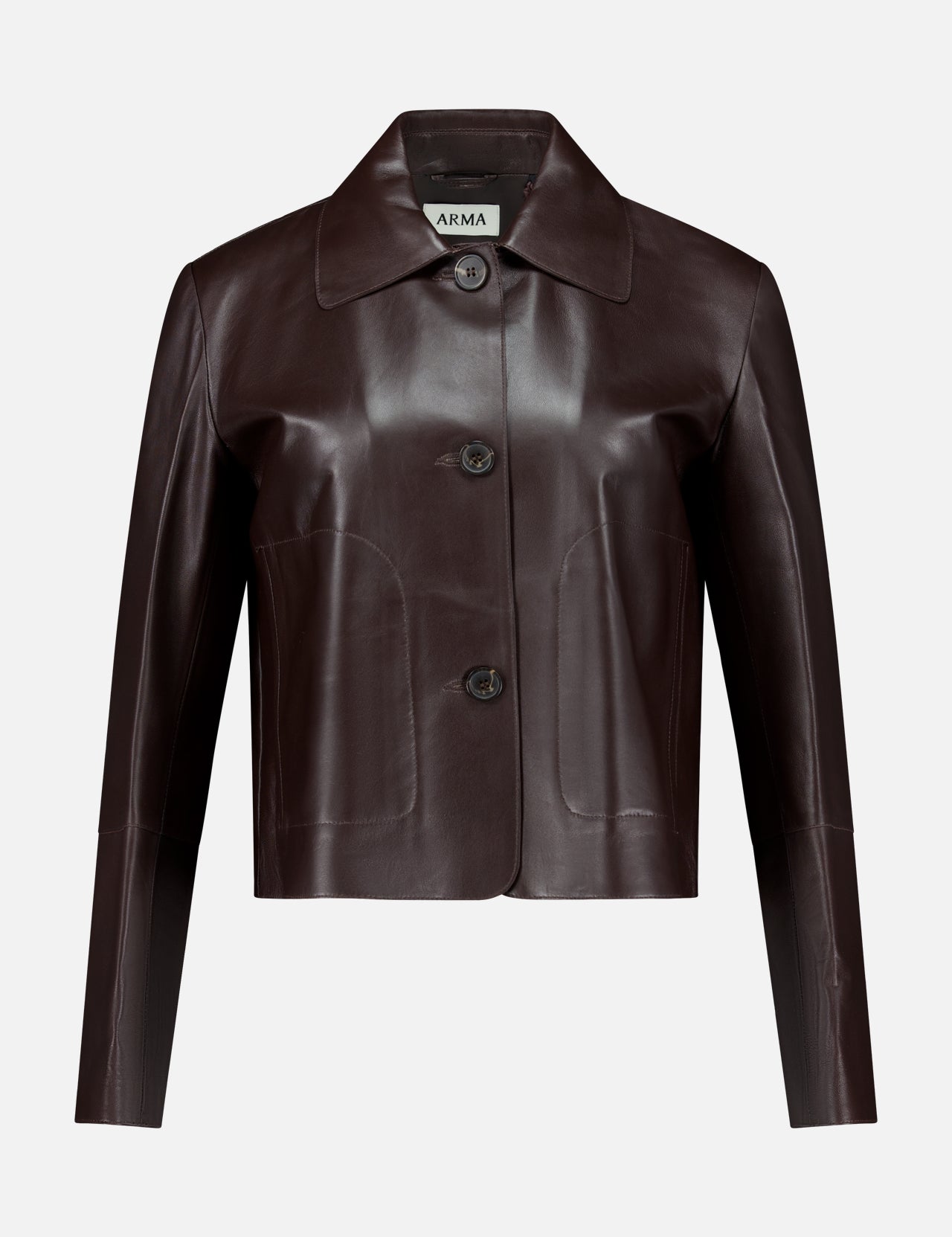 Crafted from dark brown lamb leather, the Emy Lamb Butter Coat by ARMA features a cropped, tailored silhouette with long sleeves, a collar, and three front buttons. The refined design is accented by the ARMA label visible inside the collar.