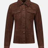 The Faye Goat Suede Sturdy Coat by ARMA is a dark brown button-up jacket in a shirt style design, featuring a classic collar, two chest pockets with flaps, and long sleeves, all elegantly showcased against a plain white background.
