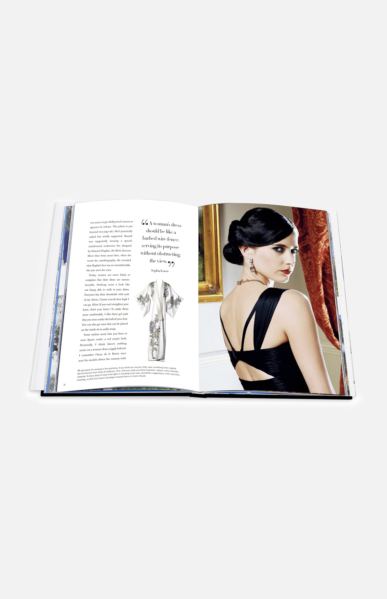 An open copy of ASSOULINE’s “Dressing For The Dark” displays text and a sketch on the left page, while on the right page, a woman in a black dress with an elegant updo and earrings is seated and glancing over her shoulder—evoking iconic fashion moments curated by celebrity stylist Kate Young.