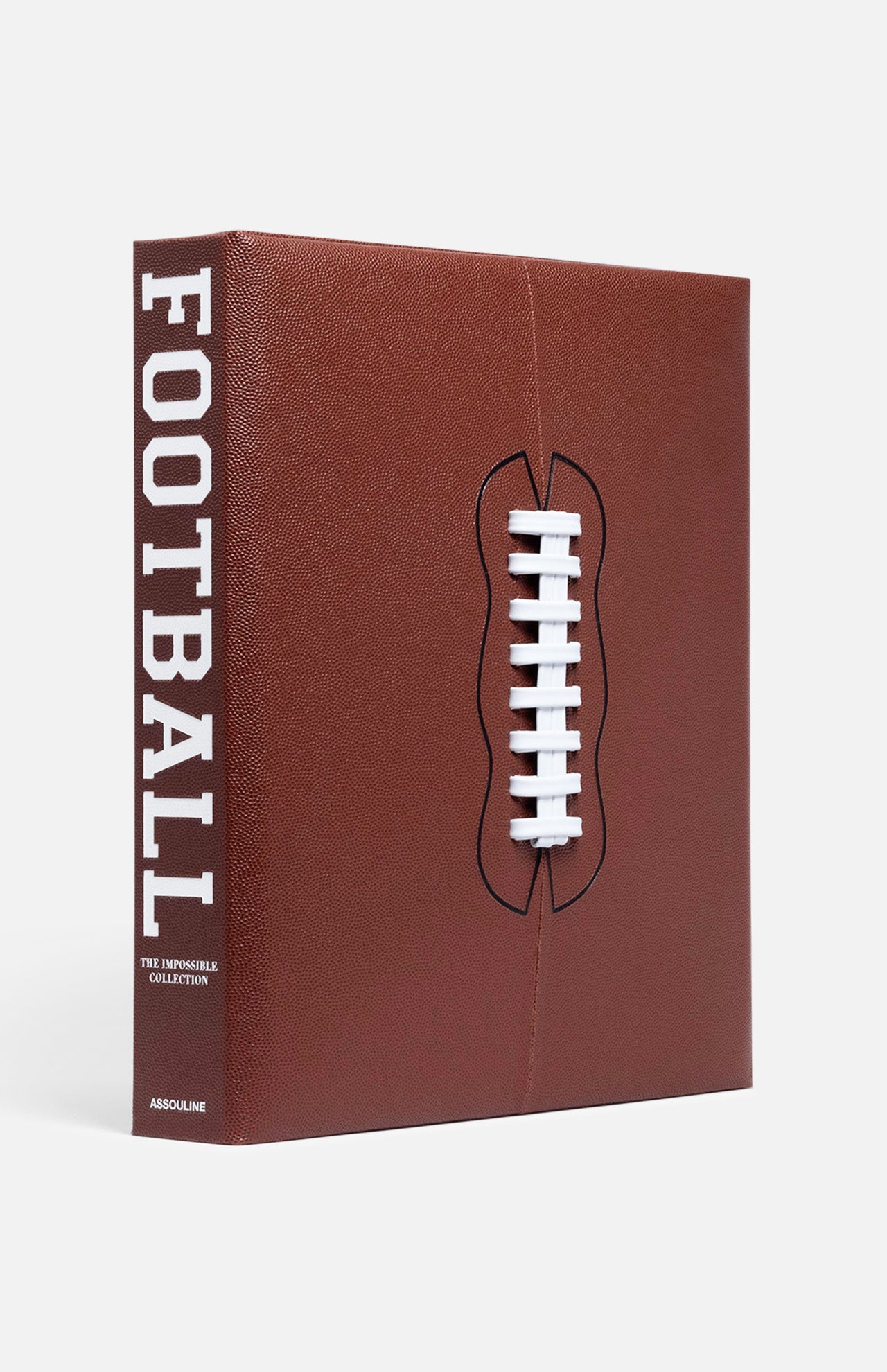 ASSOULINE’s "Football: The Impossible Collection" is a tribute to NFL and college football history, featuring a brown leather cover like a football, with white laces and FOOTBALL in bold white letters on the spine.