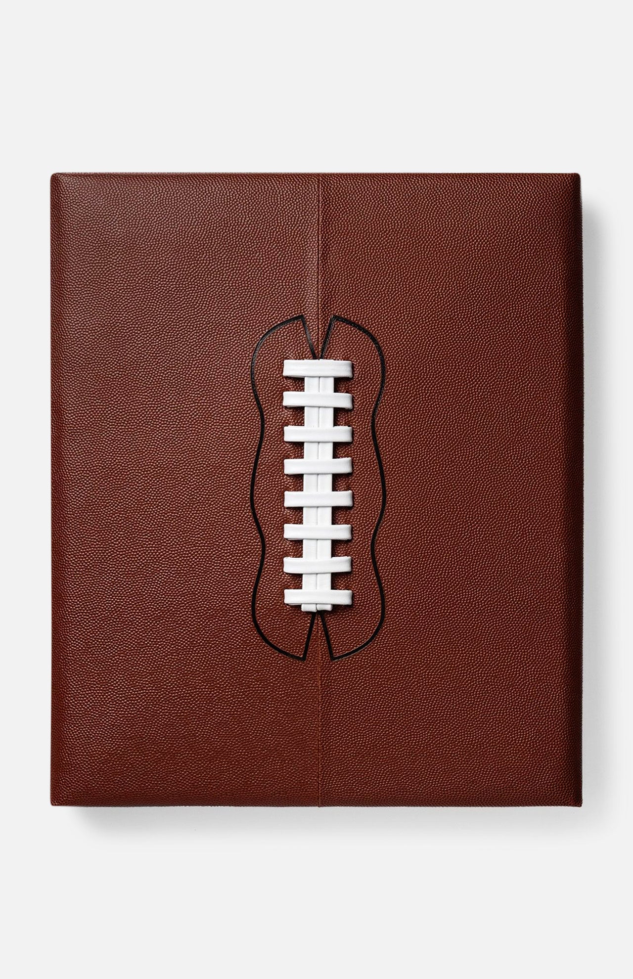Inspired by college football and NFL history, Football: The Impossible Collection by ASSOULINE features a brown, square leather cover with a white lace cutout evoking the iconic laces of an American football.