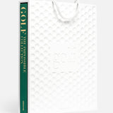 Presented in a white textured gift bag with a golf ball pattern and "golf" embossed on the front, ASSOULINE’s Golf: The Impossible Collection is the perfect luxury book for golf course enthusiasts.