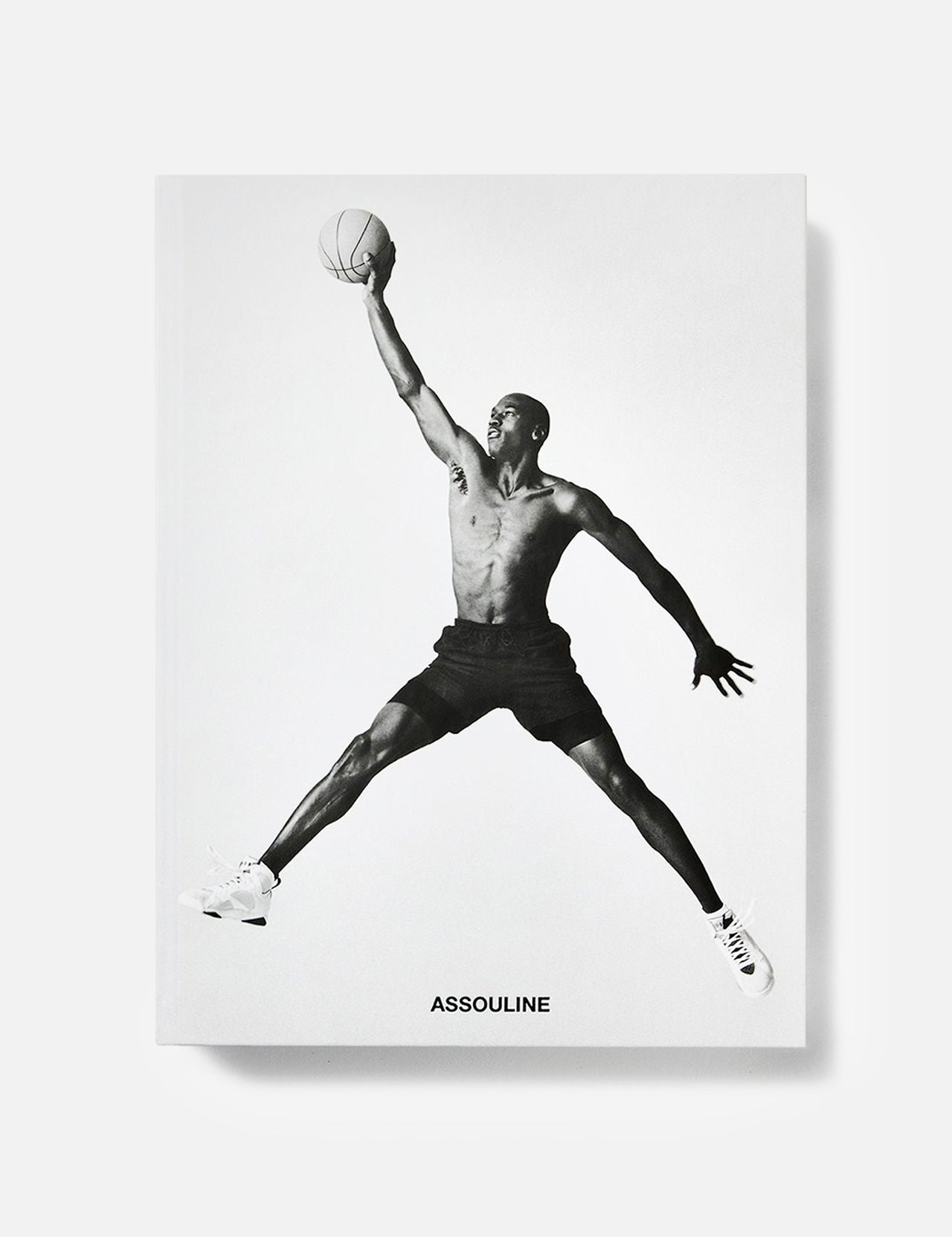 A striking black-and-white image of Michael Jordan soaring with a basketball graces the cover of the Air Jordan (Classic) Book by ASSOULINE, celebrating the legendary athlete and his iconic legacy.