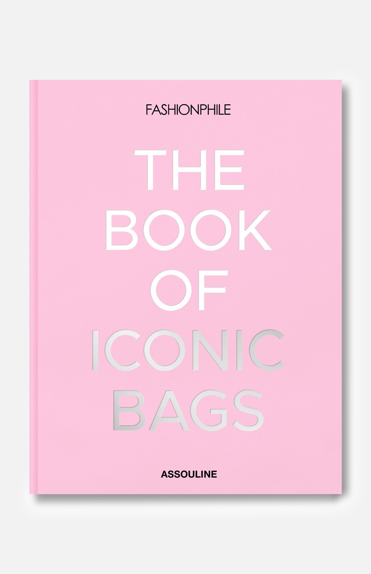 Fashionphile: The Book of Iconic Bags by ASSOULINE is a pink hardcover celebrating luxury handbags, with the title in bold white and silver on the cover—a perfect guide to iconic investment bags.