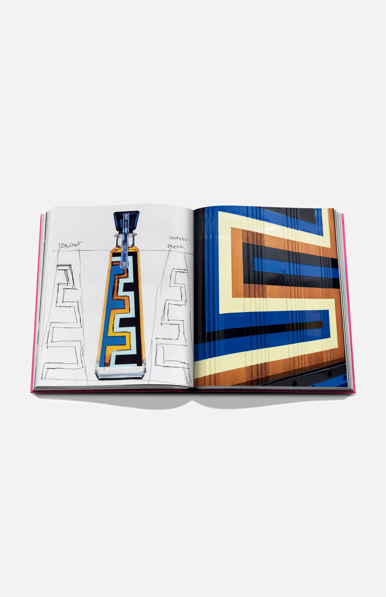 The Art of Tequila: Spirit of Mexico Book by Assouline is open, displaying geometric art in yellow, blue, black, and brown—one page features a collectible tequila bottle sketch with Greek key pattern, the other showcases colorful Mexican artwork.