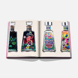 The Art of Tequila: Spirit of Mexico Book by Assouline features four vibrant collectible tequila bottles, each with colorful, intricate artwork inspired by Mexican art and patterns, displayed against a white background.