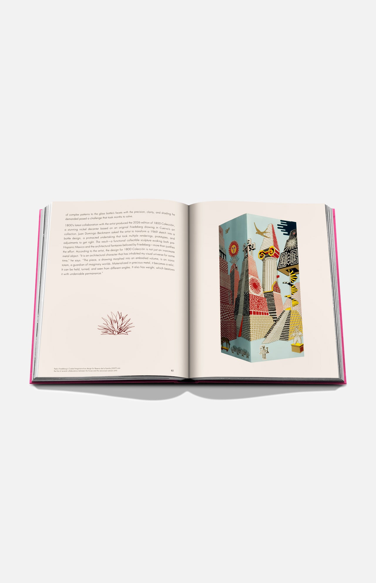 The Art of Tequila: Spirit of Mexico Book by Assouline rests on a white surface, opened to show text with a red plant illustration on the left and a vibrant, Mexican-inspired abstract artwork with plants and birds on the right.