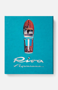 The ASSOULINE Riva Aquarama Book features an aerial view of the iconic Italian wooden speedboat on a vivid turquoise cover, with the metallic title script elegantly displayed beneath the image.