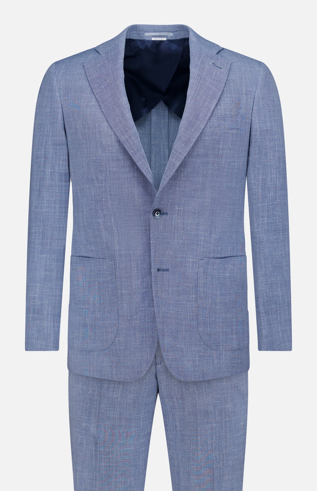 The ATELIER MUNRO Melange Wool Silk and Linen Suit in light blue features a two-button single-breasted blazer with notch lapels and two front patch pockets, paired with matching trousers, shown against a plain white background.