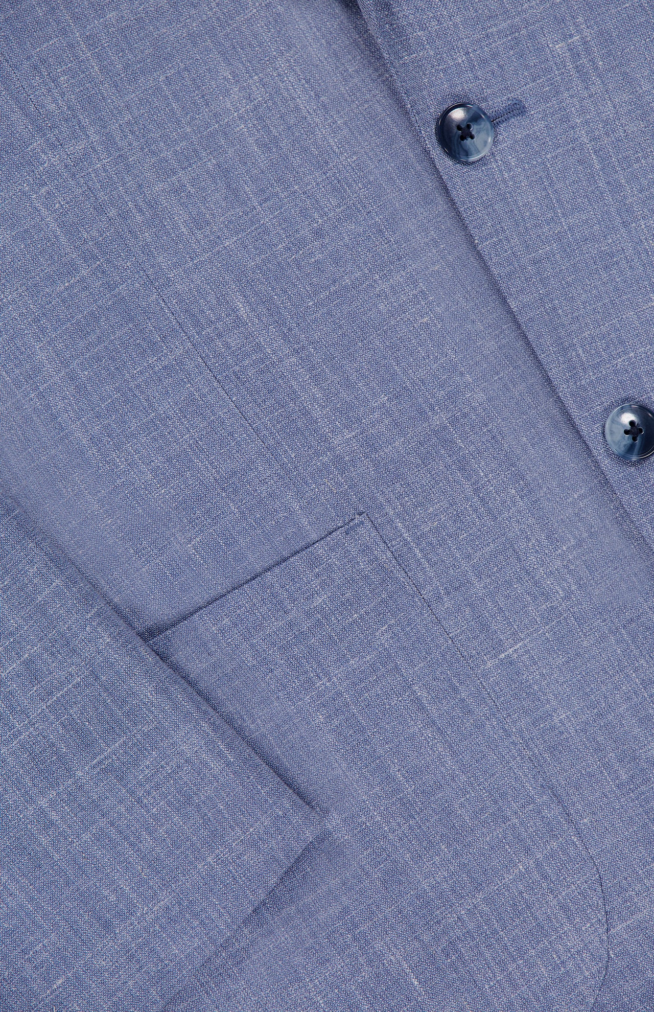 Close-up of the Melange Wool Silk and Linen Suit by ATELIER MUNRO, highlighting a front pocket, part of the sleeve, and two blue buttons on the single-breasted light blue jacket.