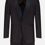 The Shawl Lapel Tuxedo Suit by ATELIER MUNRO features a dark brown pure wool design with a single button, black satin shawl lapel, and two front pockets, shown on a plain white background.