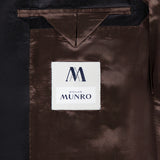 Close-up of the Shawl Lapel Tuxedo Suit’s dark brown lining with an interior pocket and a white ATELIER MUNRO label in blue and black text.